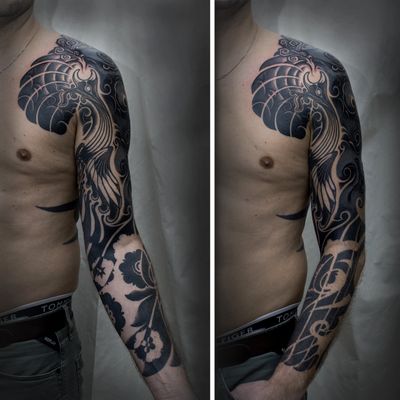 Freehand sleeve piece fullshot, the most part healed ; partly a transformation from 90s tribal style into Blackout #customtattoo #freehand #tattoo #art #tattoodesign #tattooist #Paix #Berlin #berlintattooers #tattooed #inked #pain #change #coverup #challenge #tattoodo #blackouttattoo #blackwork #blackworkers #negativespacetattoo #sleevetattoo #neotribaltattoo #ibantattoo #waves #phoenix #bungaiterung #flowers #clouds